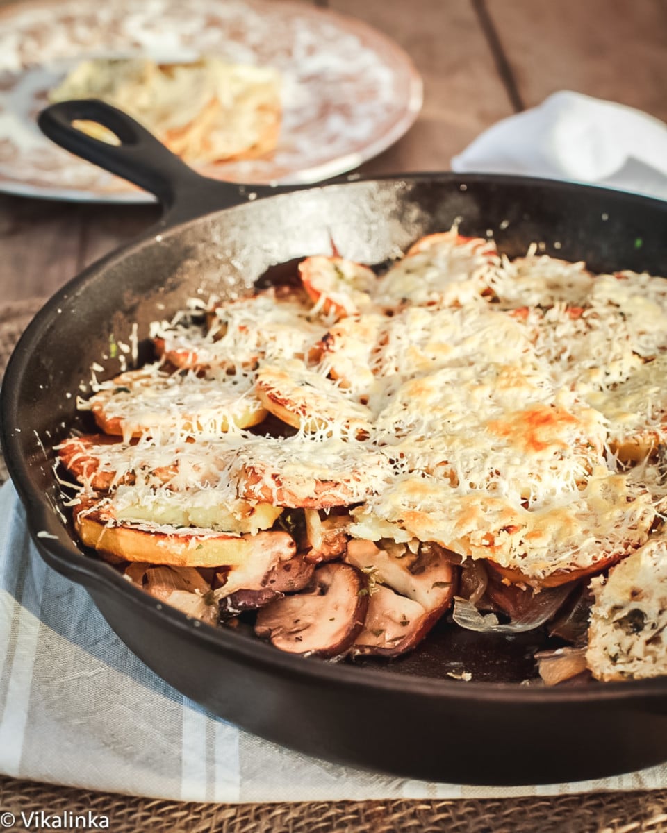 Baked Potatoes layered with caramelized onions, mushrooms and sour cream topped with Pecorino cheese.