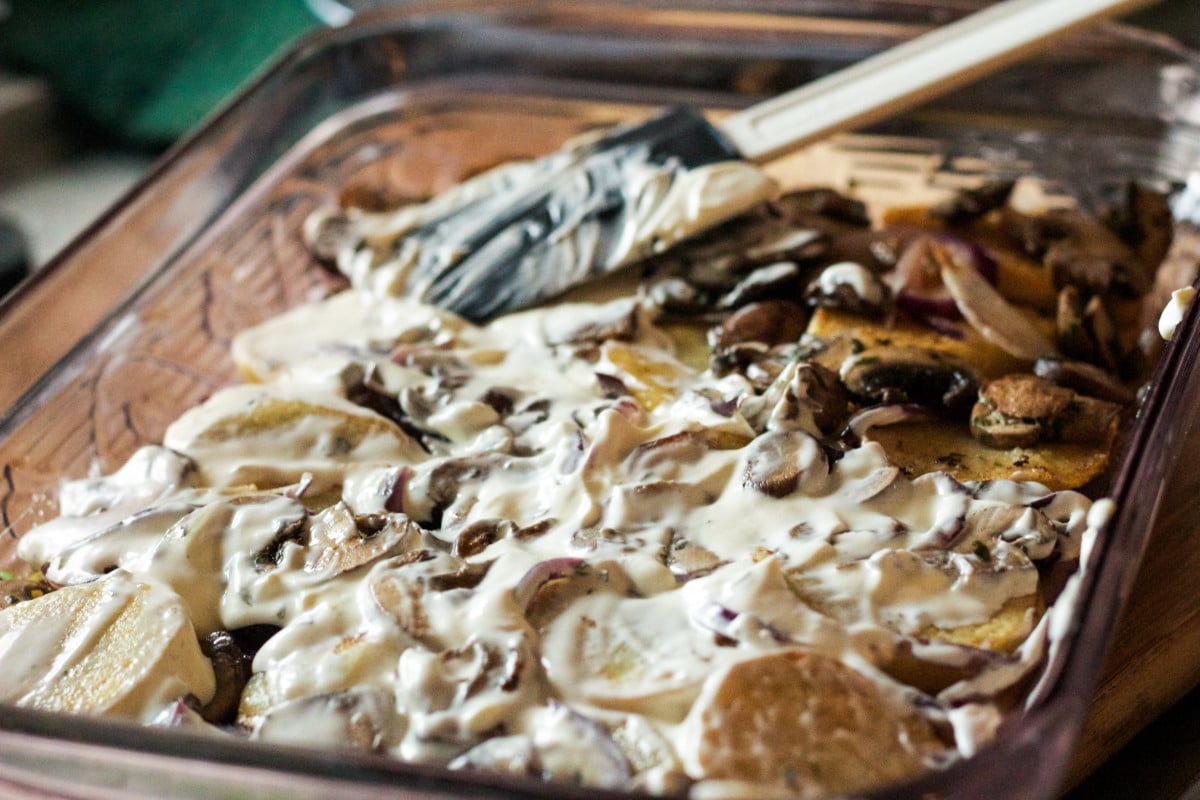 Top down view of potatoes with mushrooms and sauce