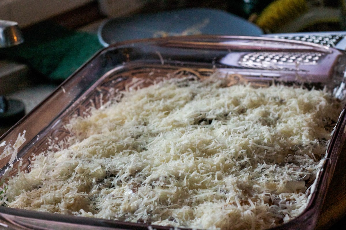 Process shot of potatoes and mushrooms with cheese