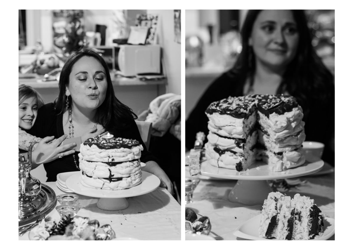 Woman standing behind cut open meringue cake