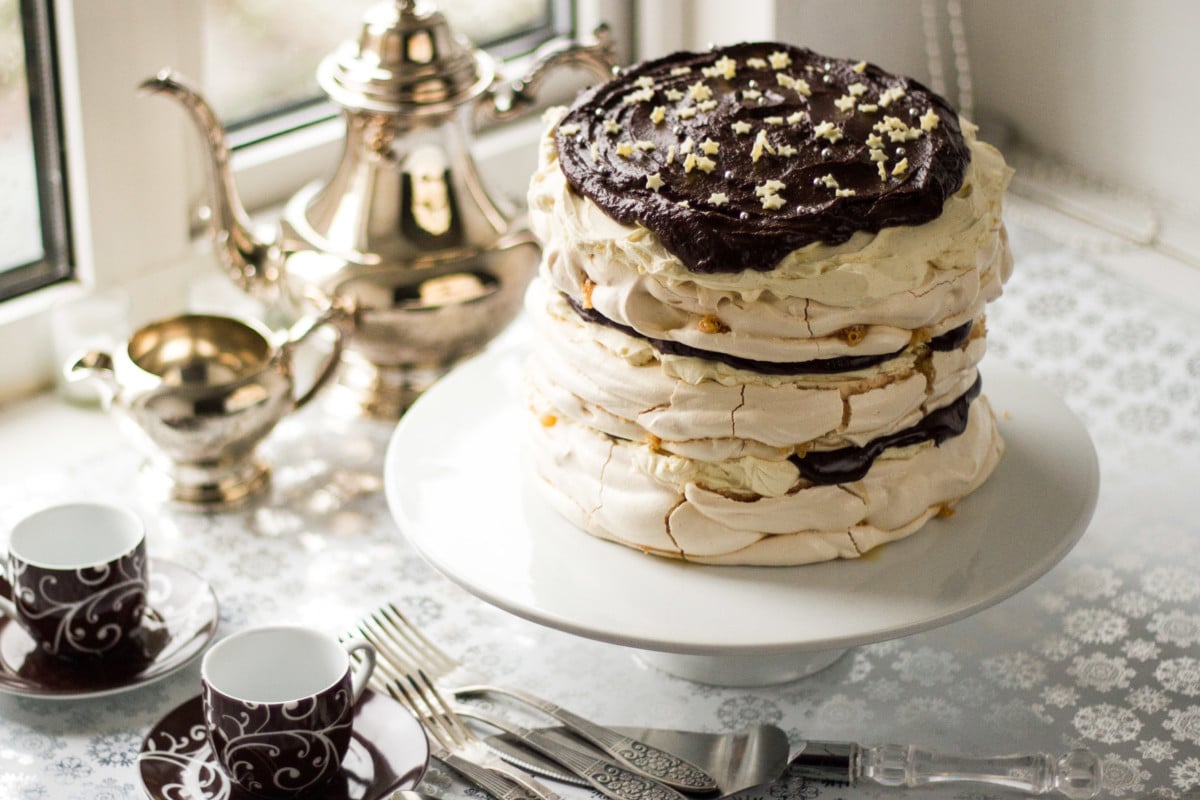 Top down view of meringue mascarpone cake on white stand