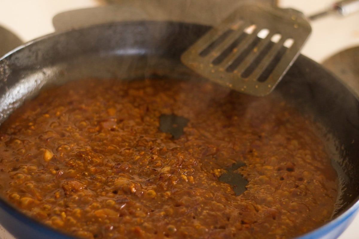 Process shot of sauce cooking in pan