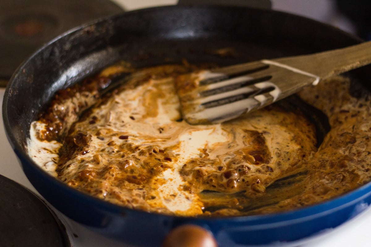 Side shotsauce ingrediants being stirred in a pan