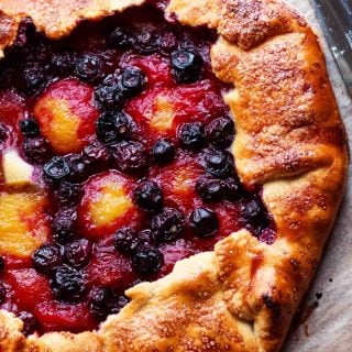 Top down of finished plum and blueberry galette