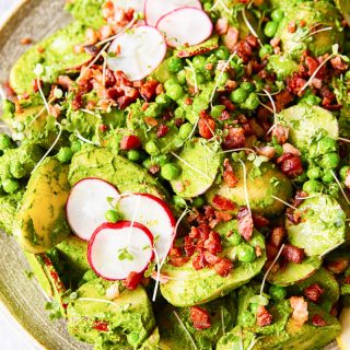 Pesto potato salad with radishes, peas and bacon