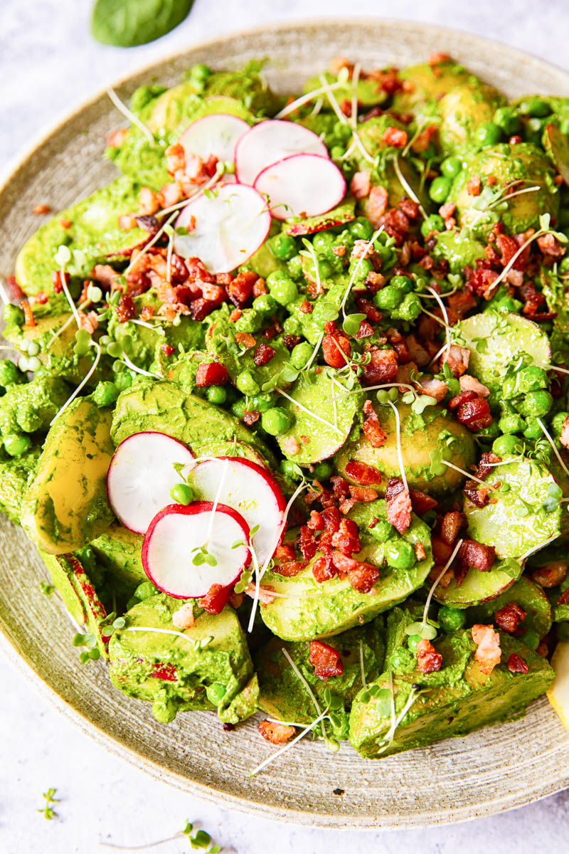 Pesto potato salad with radishes, peas and bacon