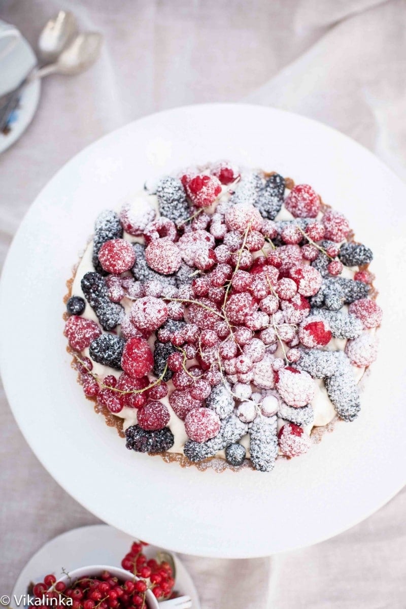 Top down of summer Berry Tart on white platter