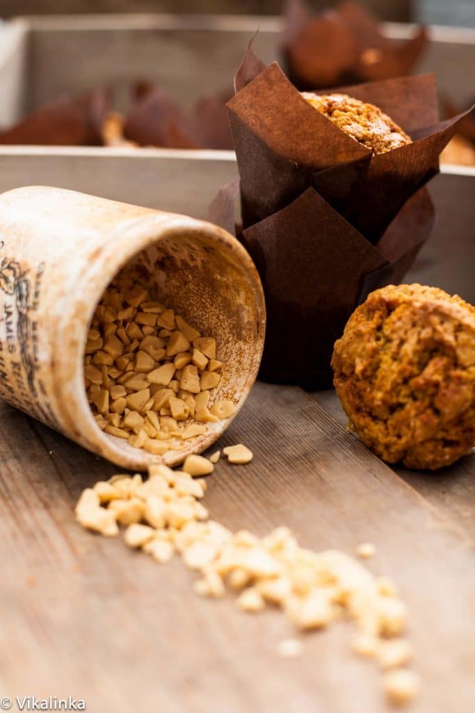 Canister spilling pieces of toffee into the foreground with baking in the background