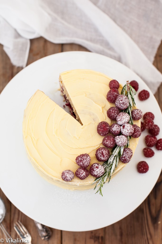 Top down view of the frostbitten raspberry cake with a slice removed