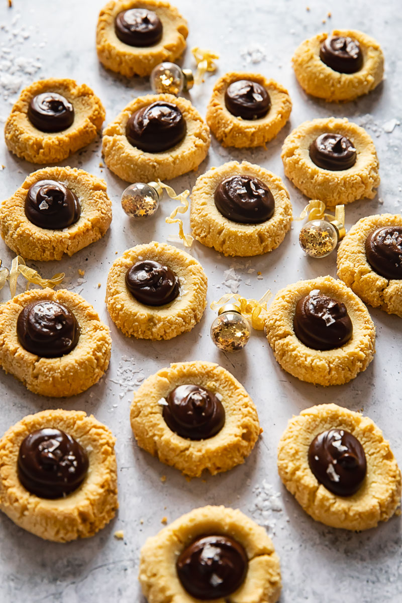 thumbprint cookies with chocolate on light background