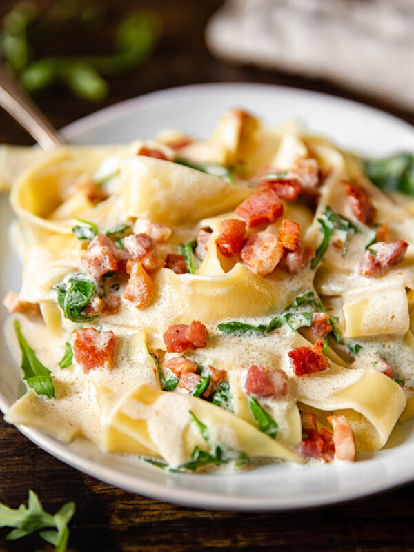 close up of Pappardelle Carbonara with Arugula