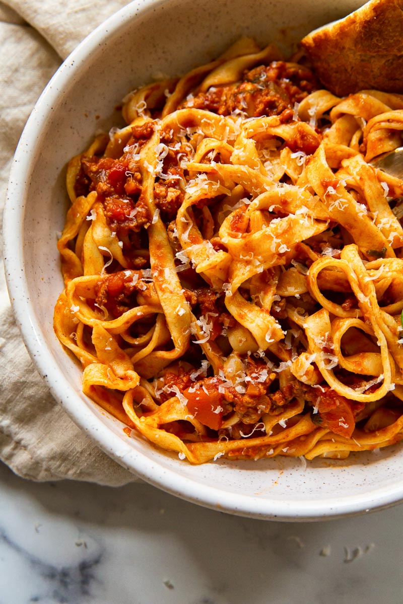 Tagliatelle with red meat sauce in bowl