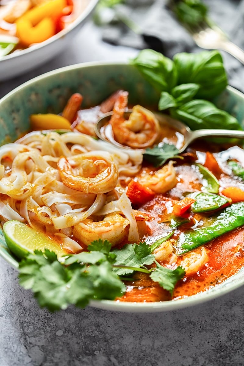 Thai Red Curry with Prawns and Snow Peas in a blue bowl