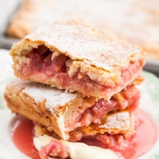 close up of Rhubarb slab pie pieces stacked on a plate