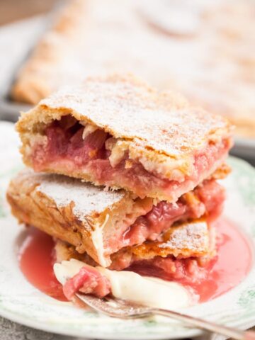 close up of Rhubarb slab pie pieces stacked on a plate