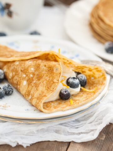 blintzes with sweet cheese filling and blueberries
