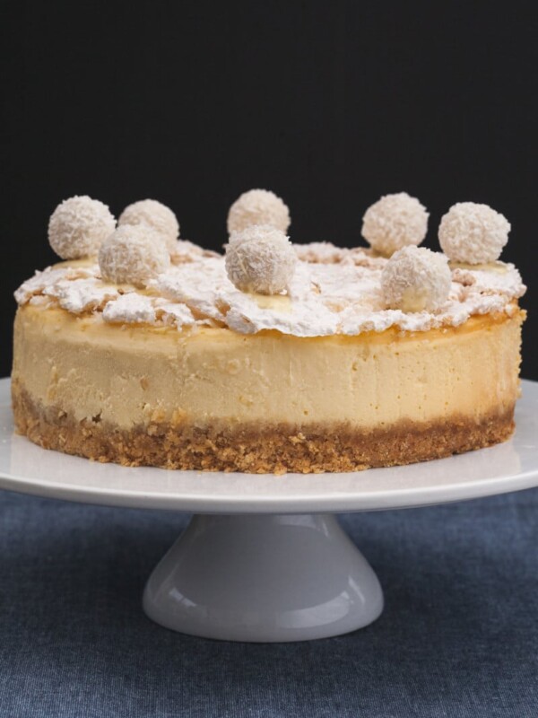raffaello cheesecake on a cake stand
