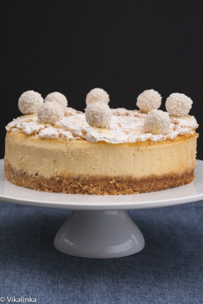 raffaello cheesecake on a cake stand