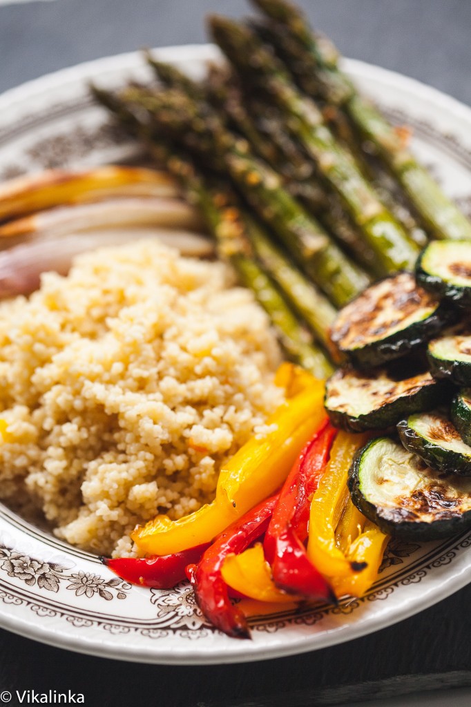 Close up of the dish with peppers and zucchini at the fore