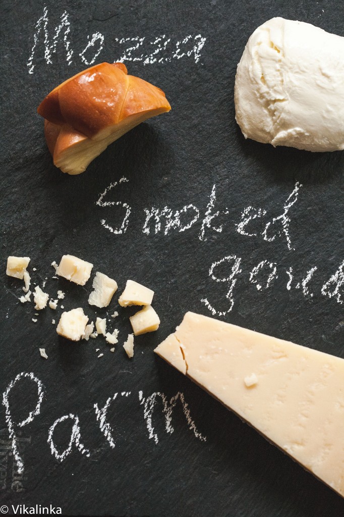 Three cheeses with names written on chalk board