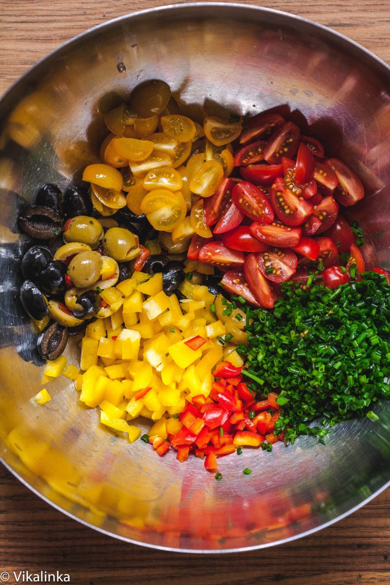 pasta salad ingredients in metal bowl