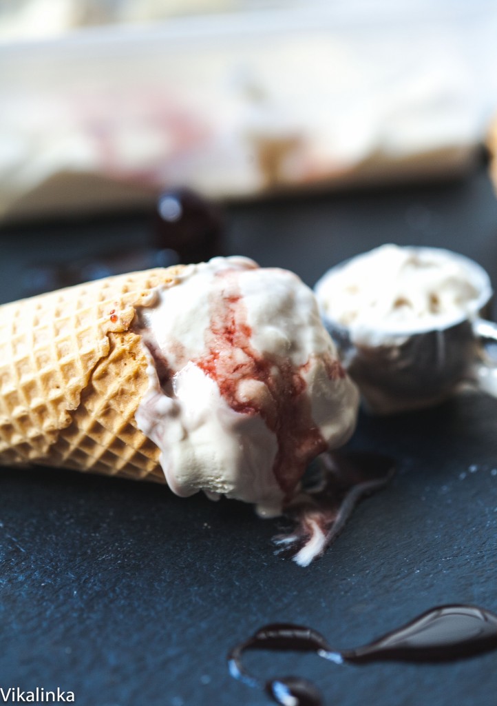 Ice cream cone with some inside lying on a table