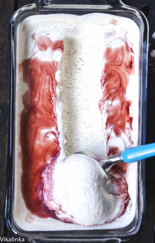 Loaf pan with gelato with scoop being removed