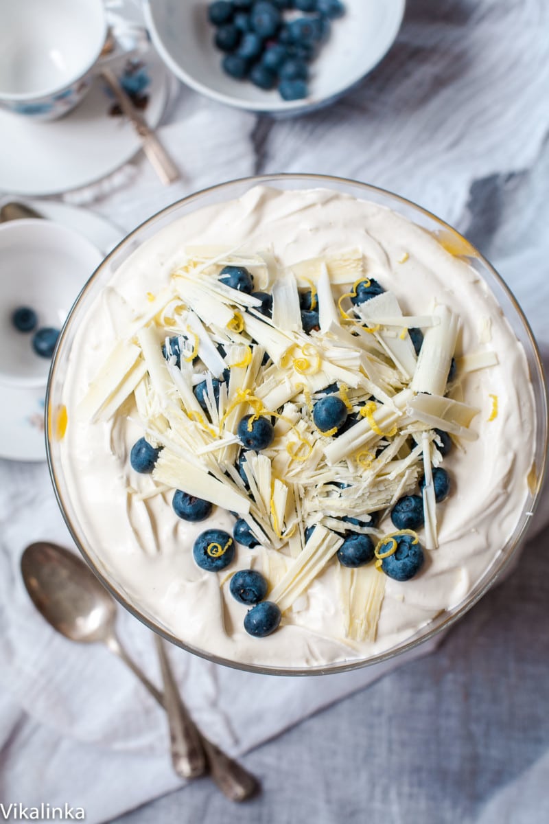 overhead view of blueberry lemon trifle topped with white chocolate shavings