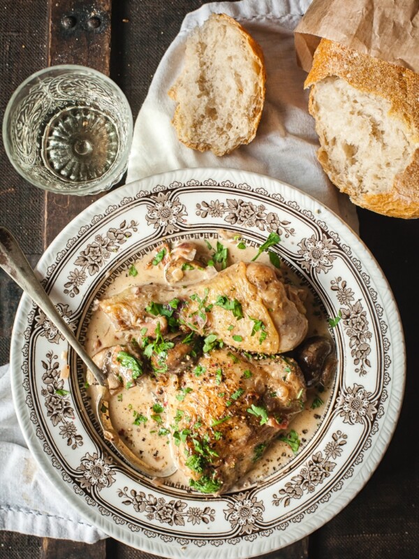 Coq au Vin Blanc in white and brown bowl