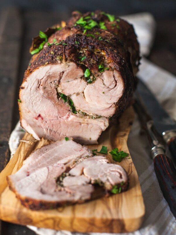 Side view of sliced pork on cutting board