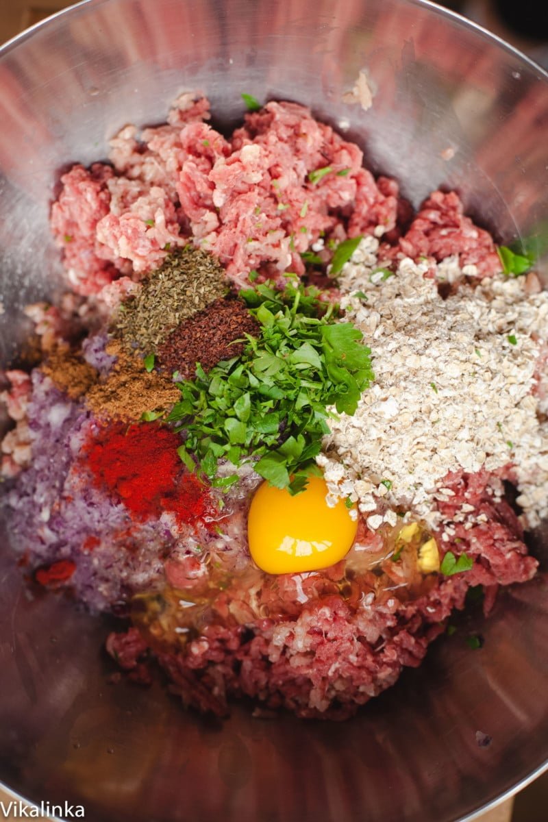 Process shot of meatball ingredients in bowl