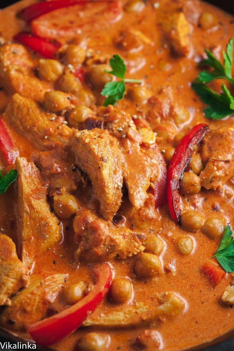 chicken paprikash with chickpeas and red peppers closeup