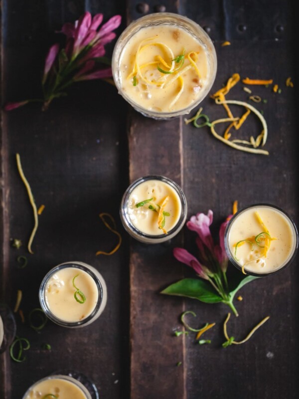 lemon posset in glasses on dark background
