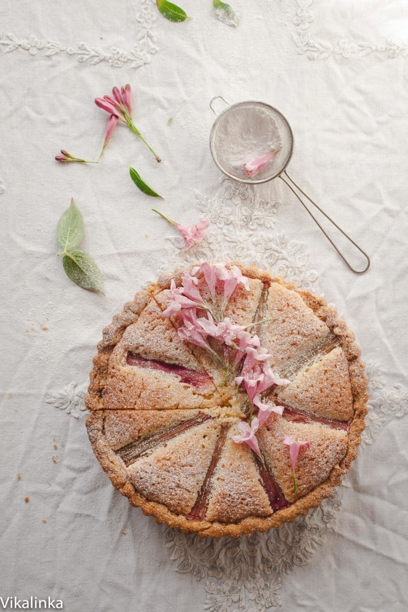 Rhubarb Bakewell Tart decorated with pink flowers