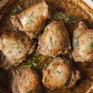 Top down shot of chicken in garlic walnut sauce