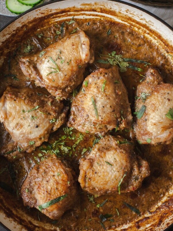 Top down shot of chicken in garlic walnut sauce