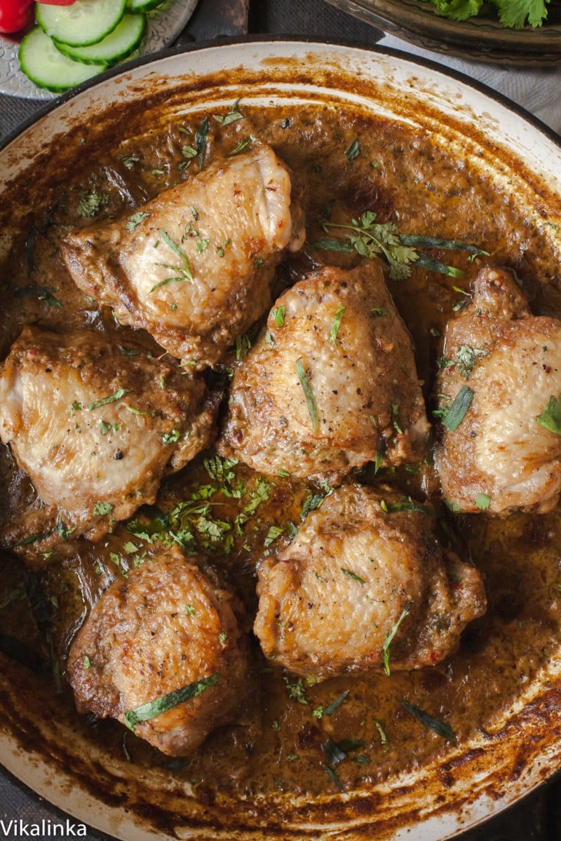 Top down shot of chicken in garlic walnut sauce