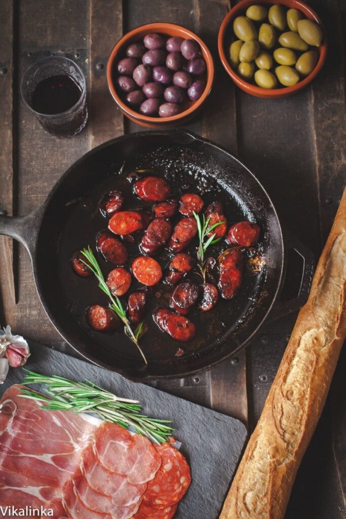 Frying pan with chorizo in red wine plus other tapas