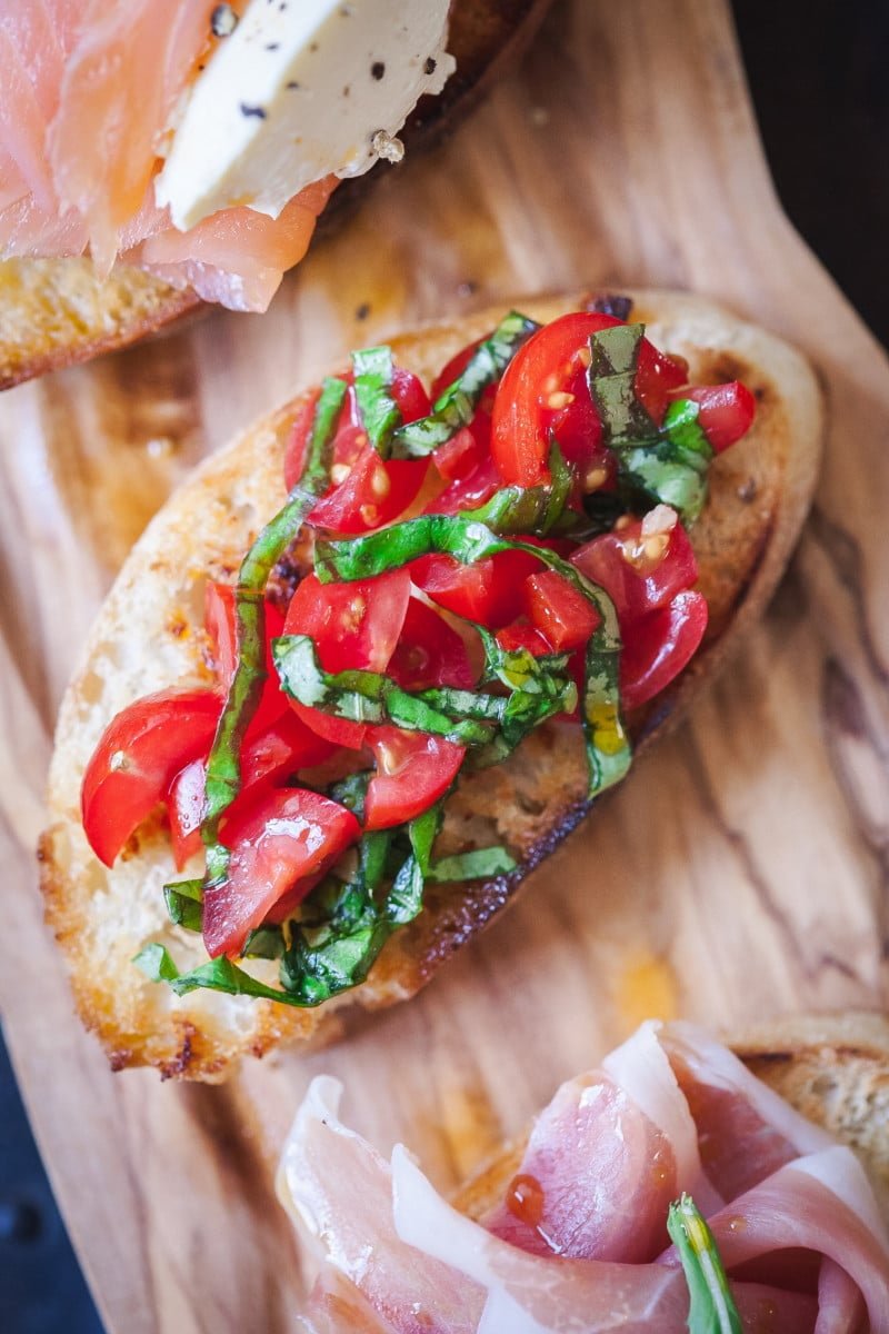 crostini topped with tomato and basil
