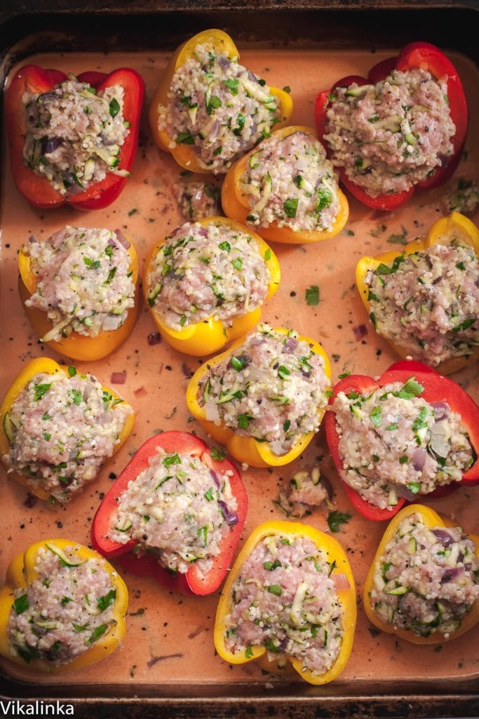Light and healthy comfort food dinner. These peppers are stuffed with extra-lean pork, shredded zucchini and gluten-free millet grain baked in a creamy tomato sauce. A family favourite!