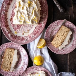 Lemon Ricotta Loaf Cake with a mound of Cream Cheese Frosting.
