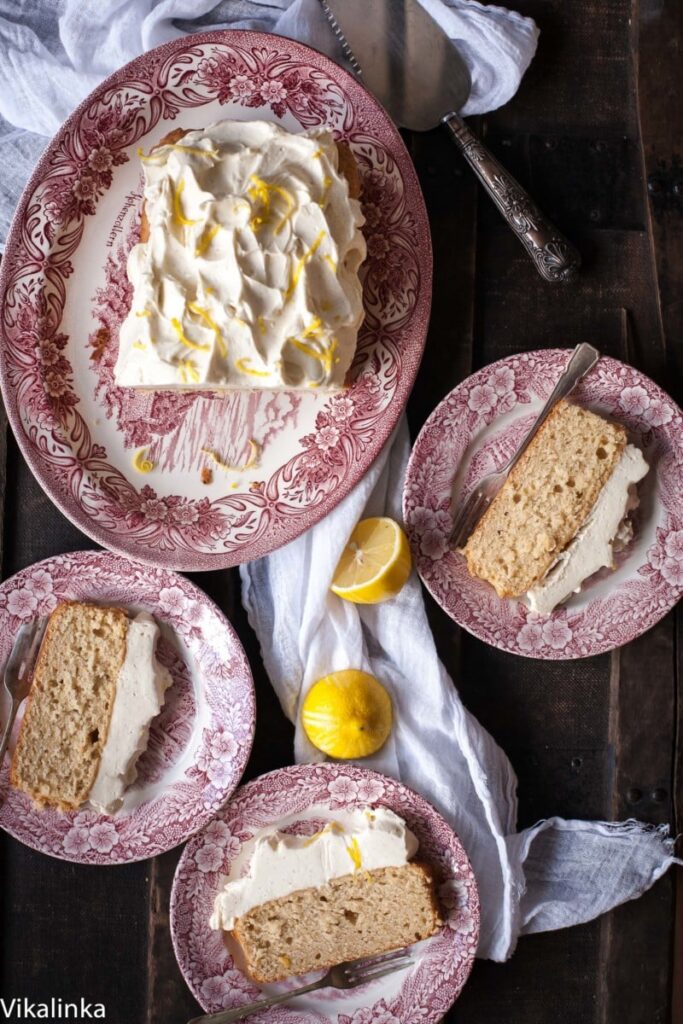 Lemon Ricotta Loaf Cake with a mound of Cream Cheese Frosting.