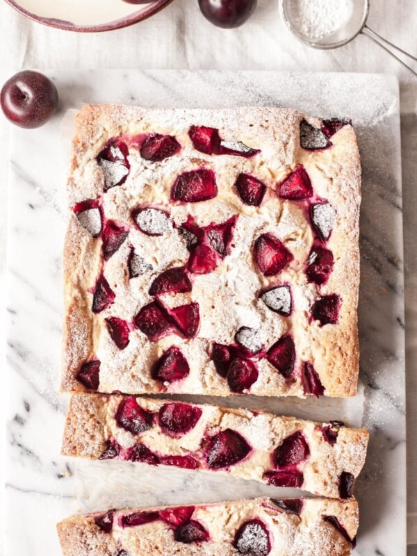 Top down view of cheesecake with two long slices cut out