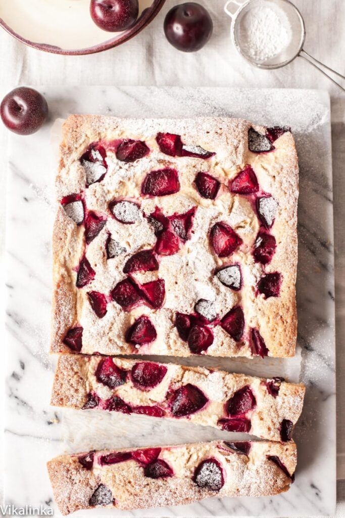 Top down view of cheesecake with two long slices cut out