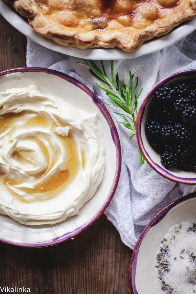 Close up view of honeyed creme fraiche and blackberries