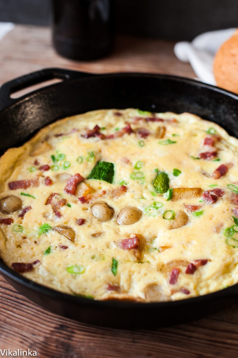 omelette with bacon and potatoes in a pan