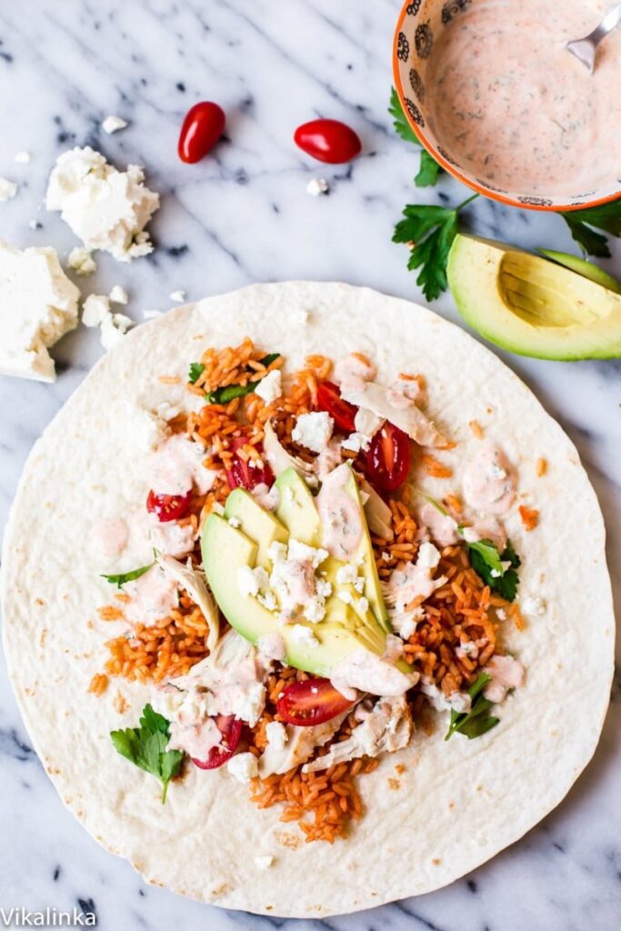 Delicious Peri Peri Rice and Chicken Wrap with Avocado and Spicy Yogurt Sauce. Your lunch just got very exciting! 