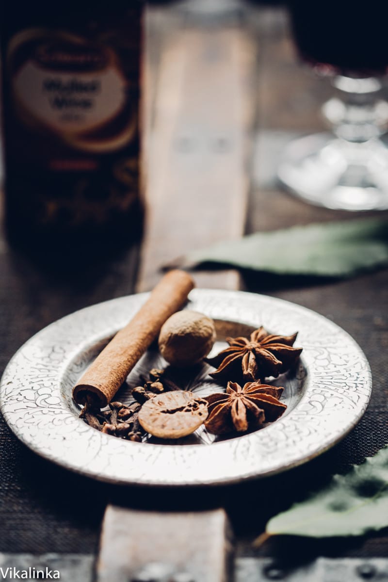 Spices and nuts on a silver plate