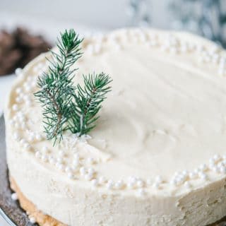Cake with beads and a small piece of evergreen