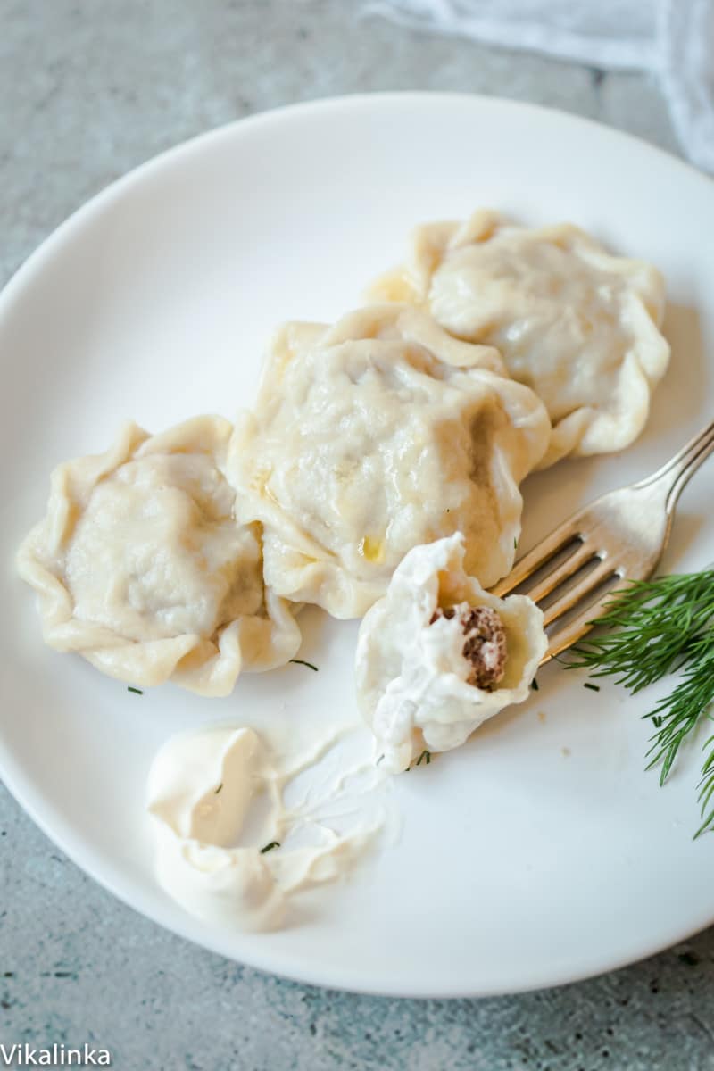 close up of pelmeni dumplings on a plate